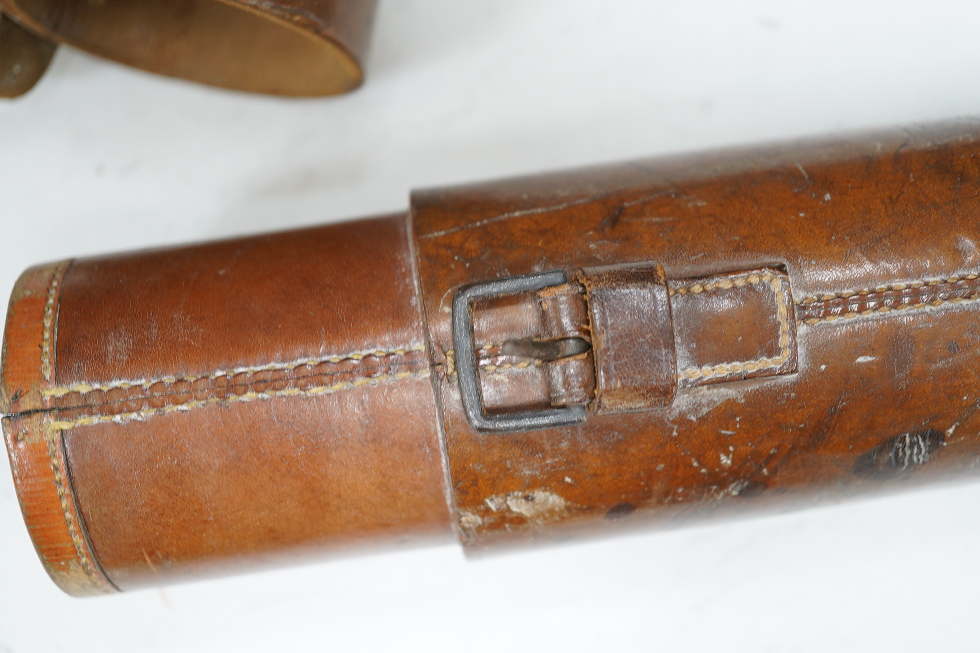 A leather cased Dolland three draw telescope, 72cm fully drawn. Condition - fair considering use